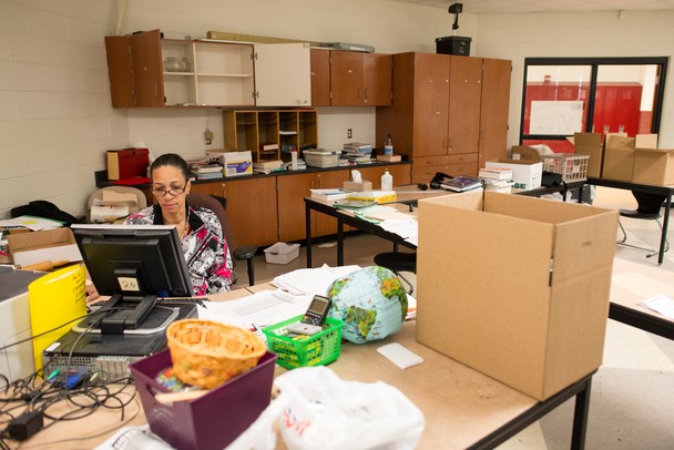 Rhonda Williams, a teacher at Willow Run Middle School for 29 years, sits in her half-packed classroom on the school's last day open, Friday, June 7.
Courtney Sacco I AnnArbor.com 